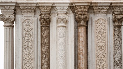 Obraz premium Architectural decorative features including columns and capitals, gypsum stucco designs, and textured wall patterns found in urban public spaces. Vintage isolated patterns.