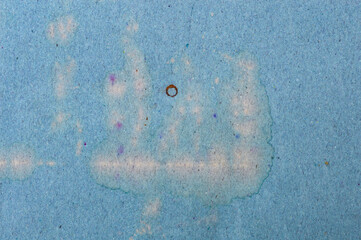 Aged, dirty, and wrinkled blue cardboard texture. Faded, dull surface with creased folds. Grunge vintage paper background for abstract design and rough overlay mockups. 