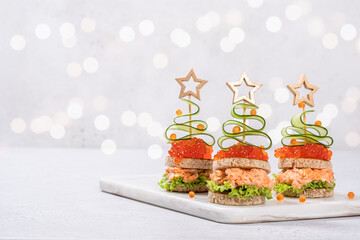 Christmas tree canape with Smoked Salmon and red caviar