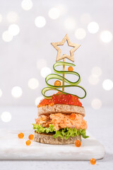 Christmas tree canape with Smoked Salmon and red caviar