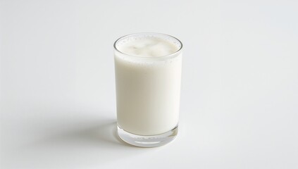 Tasty protein smoothie served in a clear glass against a white backdrop