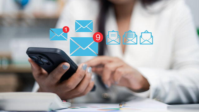 Businesswoman using smartphone with email notification icons, digital communication and online messaging concept