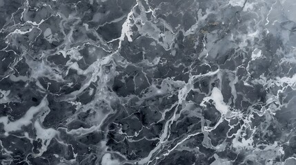 Obraz premium Elegant dark grey and white marble texture showcasing intricate veins and swirling abstract patterns, perfect for luxurious backgrounds, interior design, and sophisticated graphic projects.