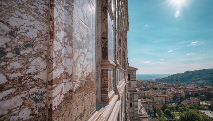 Fototapeta premium Close-up of an ancient cathedral facade under bright summer sunlight