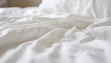Close-up of a white fabric with wrinkles and ripples, softly focused