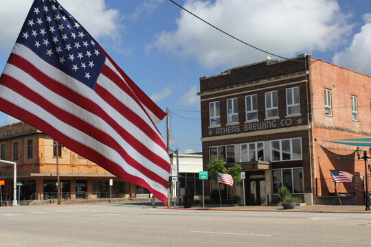 Athens, TX - June 18, 2025: Historic Downtown Athens Texas With Buildings and Flags Athens TX