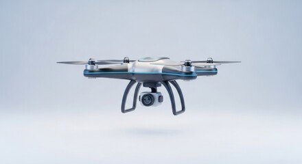 A gray and white drone with a camera flying in the air.