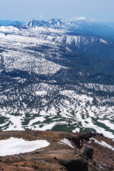 View of Tokachi Mountain Range from Mt. Asahidake Trail, Hokkaido, Japan, with Remaining Snow