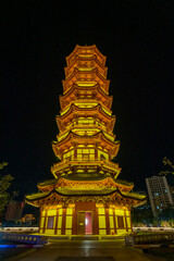 Luminous Attic and Pagoda in the Night Scene of Ancient City, Xichang, Sichuan, China