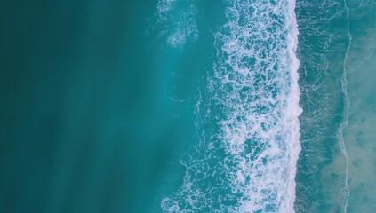 Drone shot capturing the turquoise waters and ocean waves in daylight