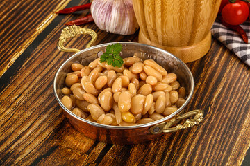 Baked white canned beans in the bowl