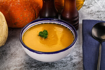 Vegan pumpkin cream soup served sesam