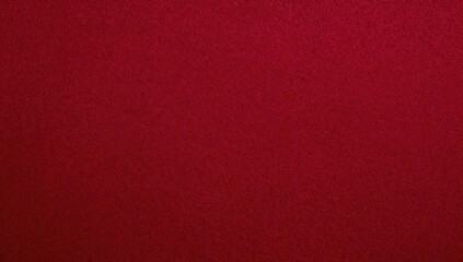 Deep crimson velvet material texture serving as a backdrop. Blank red textile surface with a soft and silky feel. Area available for text.