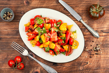 Delicious vegetable salad with fresh tomatoes.