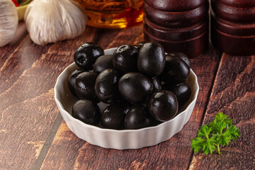 Mediterranean marinated Black olives in the bowl