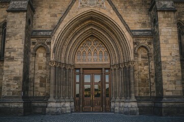 Fototapeta premium Entryway of the ancient Gothic cathedral structure, travel, architecture, glass, door, stone, historic, stunning