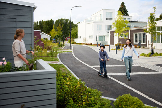 Residents greeting each other while spending leisure time in their residence