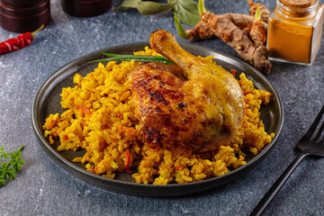Roasted chicken leg with yellow rice