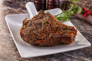 Baked beef steak on the bone