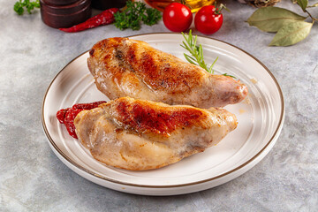 Roasted rabbit leg served rosemary