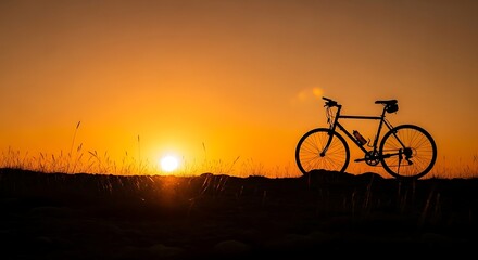 Fototapeta premium Silhouette of a bicycle against a vibrant sunset backdrop.