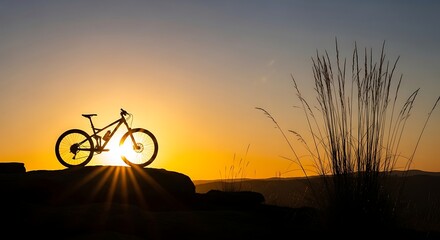 Silhouette of a mountain bike against a vibrant sunset sky.