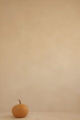 Single Pumpkin on Soft Warm Beige Minimalist Background