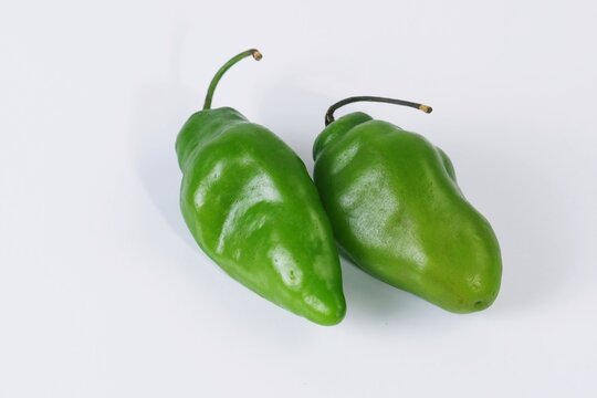 Fresh green cabe gendot chili peppers or Green Habanero Chili Peppers  isolated on white background.