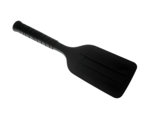 A black paddle with a ribbed handle, angled diagonally on a black background