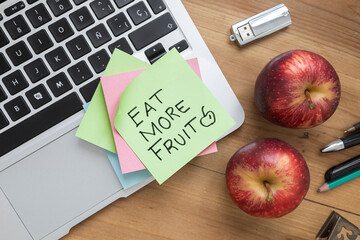 &ldquo;Eat More Fruit&rdquo; Sticky Note on Laptop &mdash; Healthy Lifestyle Motivation