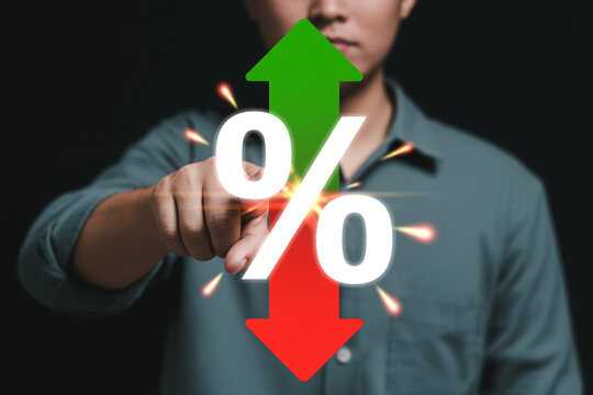 Interest rates rising and falling concept financial market percentage increase decrease investment man pointing