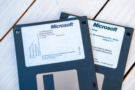 Vintage Microsoft floppy disks for Windows, retro computer software installation media 80s, early PC technology, data storage and digital nostalgia, information storage, old school technology