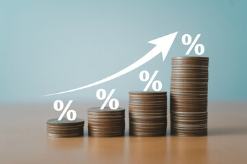 Investment growth concept with coins and percentage sign showing increasing return on investment