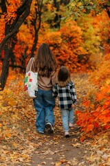 Family Walking With Pet Golden Retriever Dog Along Autumn Woodland Path Together