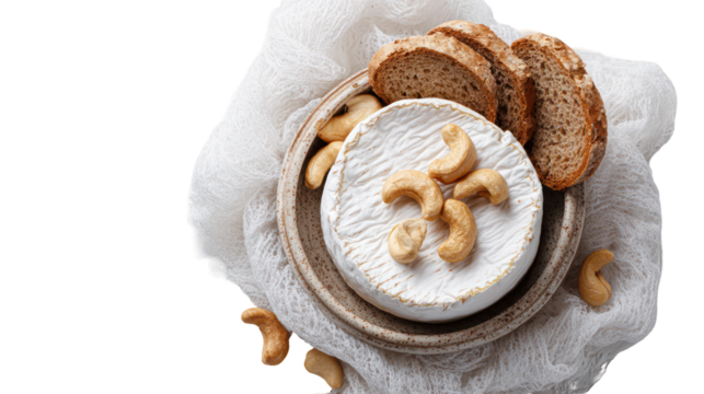 Whole brie cheese with nuts and bread slices isolated on transparent background