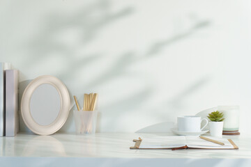 Elegant home office scene with neutral colors and simple stationery arrangement.