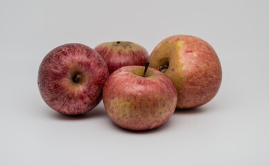 A composition of a typically autumnal fruit, such as the Annurca apples from Campania, which enhances its beauty and details.
