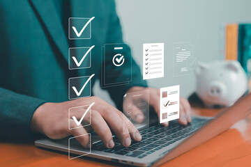 Businessman using laptop with virtual checklist icons on screen, representing task management, productivity, workflow organization, digital planning, and online project management modern business