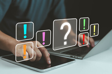 Digital communication concept with question mark and exclamation mark icons on screen, symbolizing...