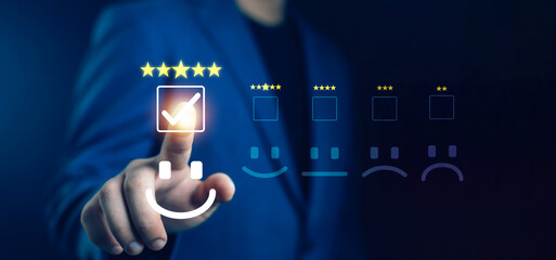 Hand pressing five-star rating with happy smile icon on virtual screen, representing excellent customer satisfaction, positive feedback, online review, quality service, and user experience evaluation.