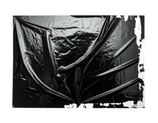 Abstract studio shot of a draped, wrinkled dark material, on a stark white backdrop