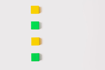 Four Wooden Cubes in Vertical Line on White