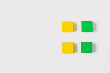Four Wooden Cubes in a Square Grid on White