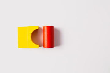 Simple Yellow and Red Wooden Blocks on White Background