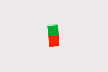 Minimal Green and Red Wooden Blocks on White Background