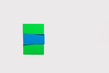 Green and Blue Wooden Blocks on White Background