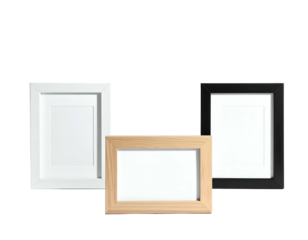 Three blank picture frames, one white, one black, and one natural wood, against black