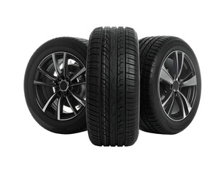 Obraz premium Three black car tires with sporty rims against a stark black background