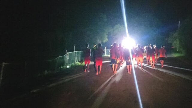 Authentic nighttime footage of Kanwariya devotees joyfully dancing while carrying decorated Kanwars Kawads during the sacred Kanwar Yatra in the holy month of Shravan Sawan, India.