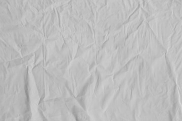 Plastic texture with wrinkles and folds, isolated transparent background. Crumpled synthetic surface for design, packaging and overlay